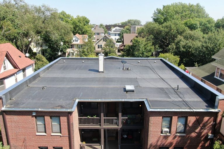 Drone aerial view of commercial flat roof replacement in Minneapolis