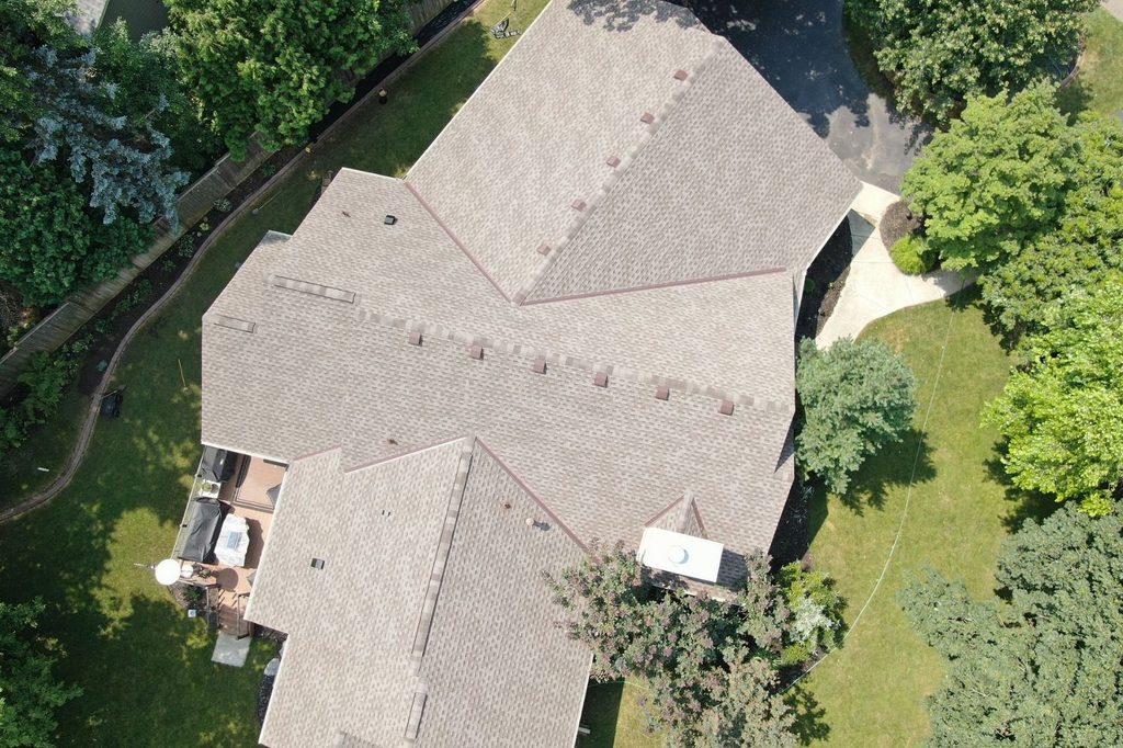 Overhead drone shot of new GAF Timberline HDZ shingles on Minnetonka home
