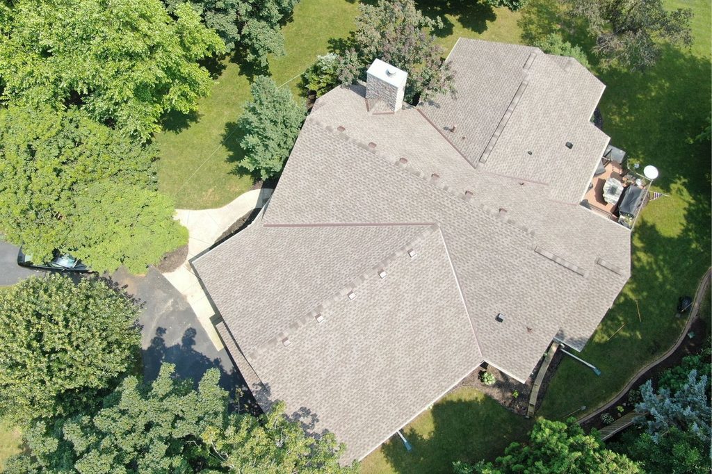 Aerial view of finished shingle roof replacement in Minnetonka
