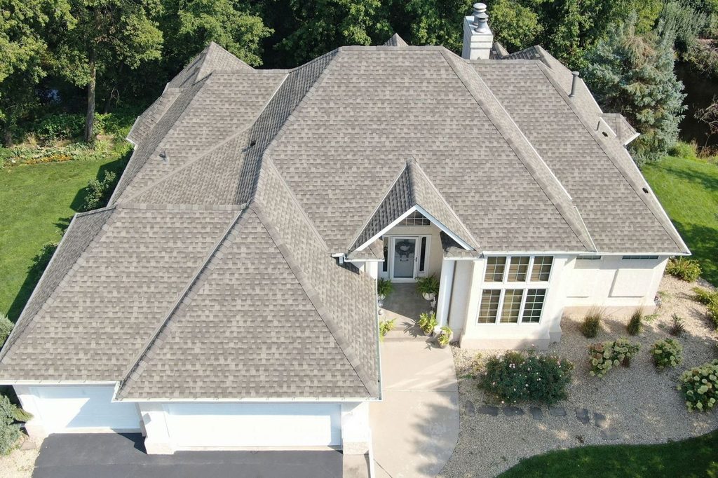 Front facing aerial view of completed asphalt roof replacement in Plymouth, MN