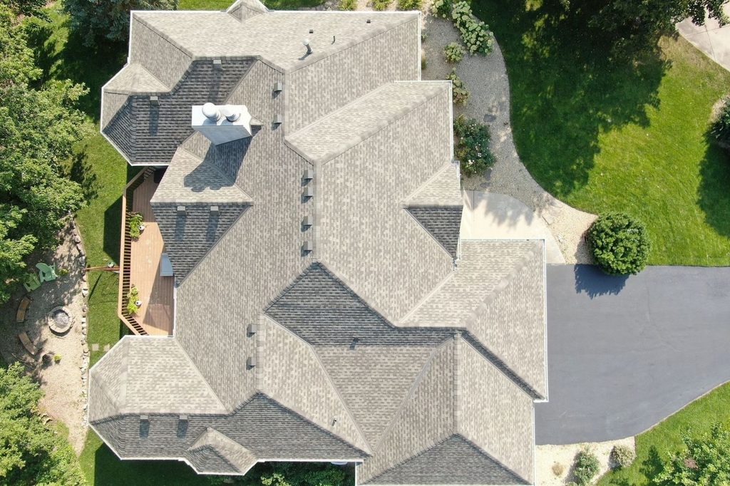 Top down aerial shot of new shingle roof on Plymouth home