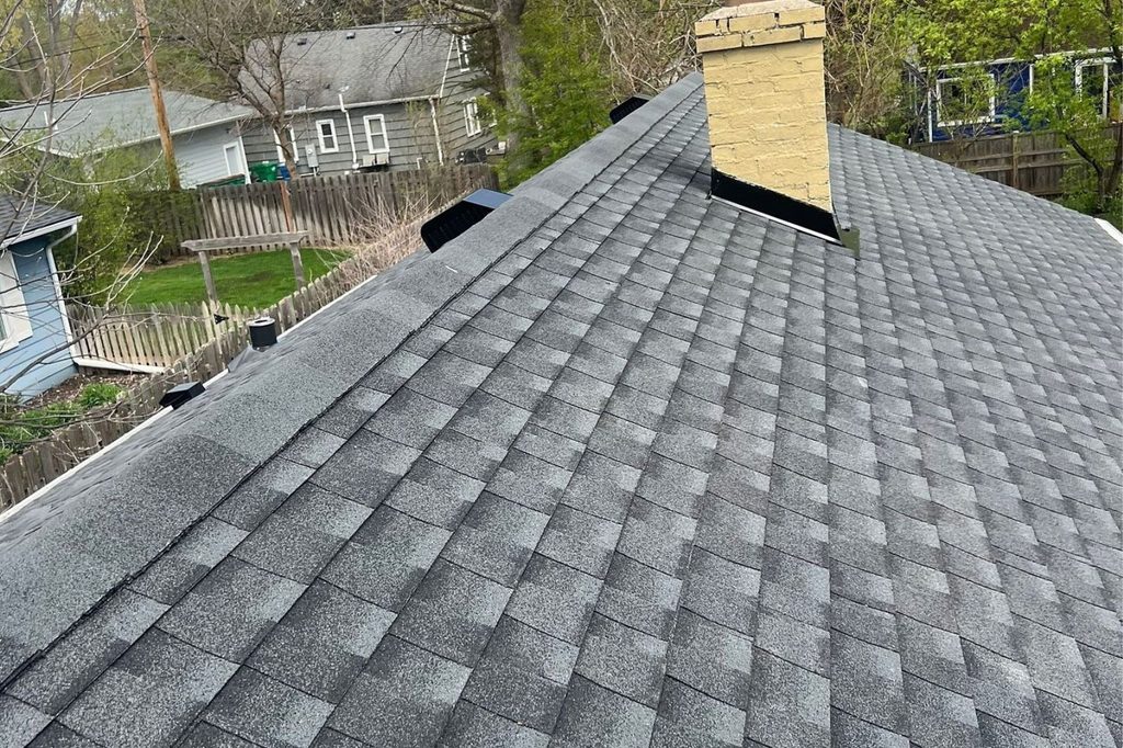 Close up of ridge and chimney flashing on Minnetonka roof replacement